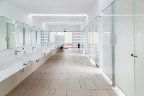 Modern bathroom interior in marble with glass door shower and window in port